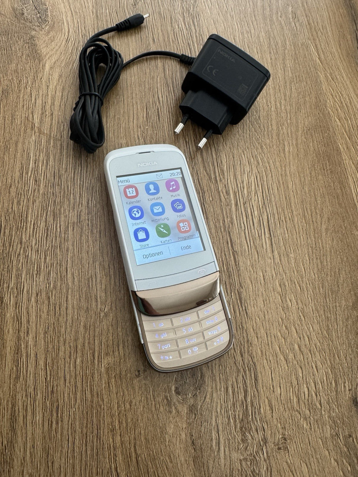 6980855