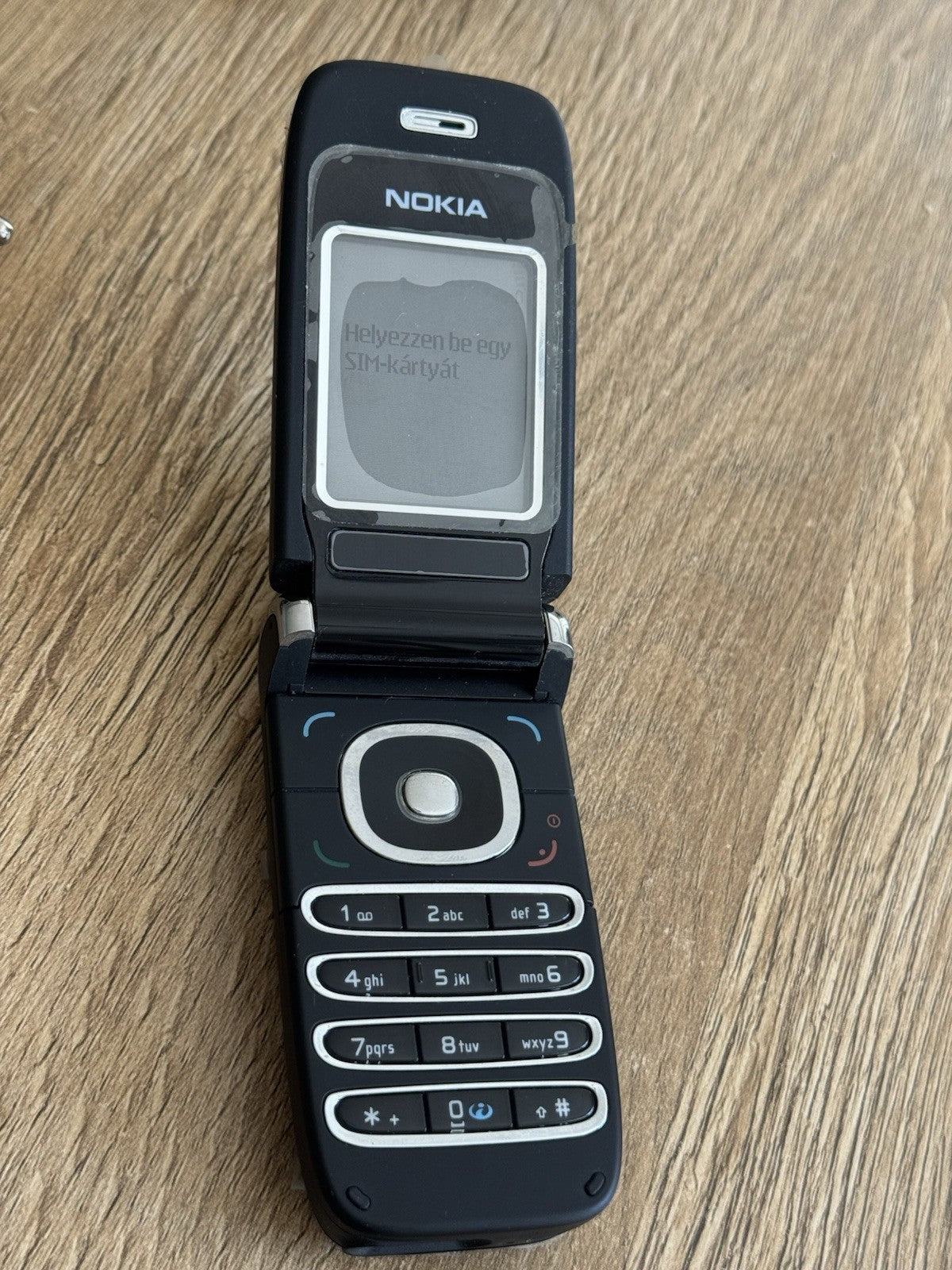 6980894